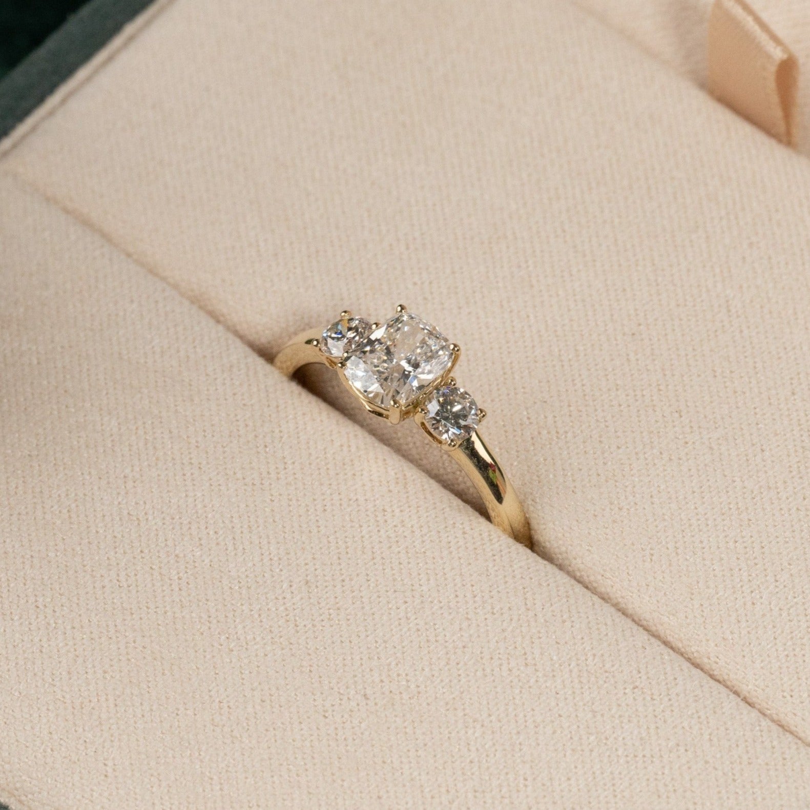 THREE-STONE RECTANGULAR CUSHION-CUT DIAMOND RING YG